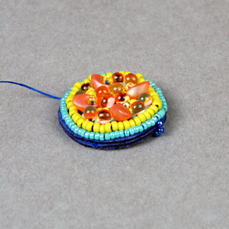 Front view of bead embroidered earrings